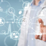 Doctor pointing at digital healthcare icons